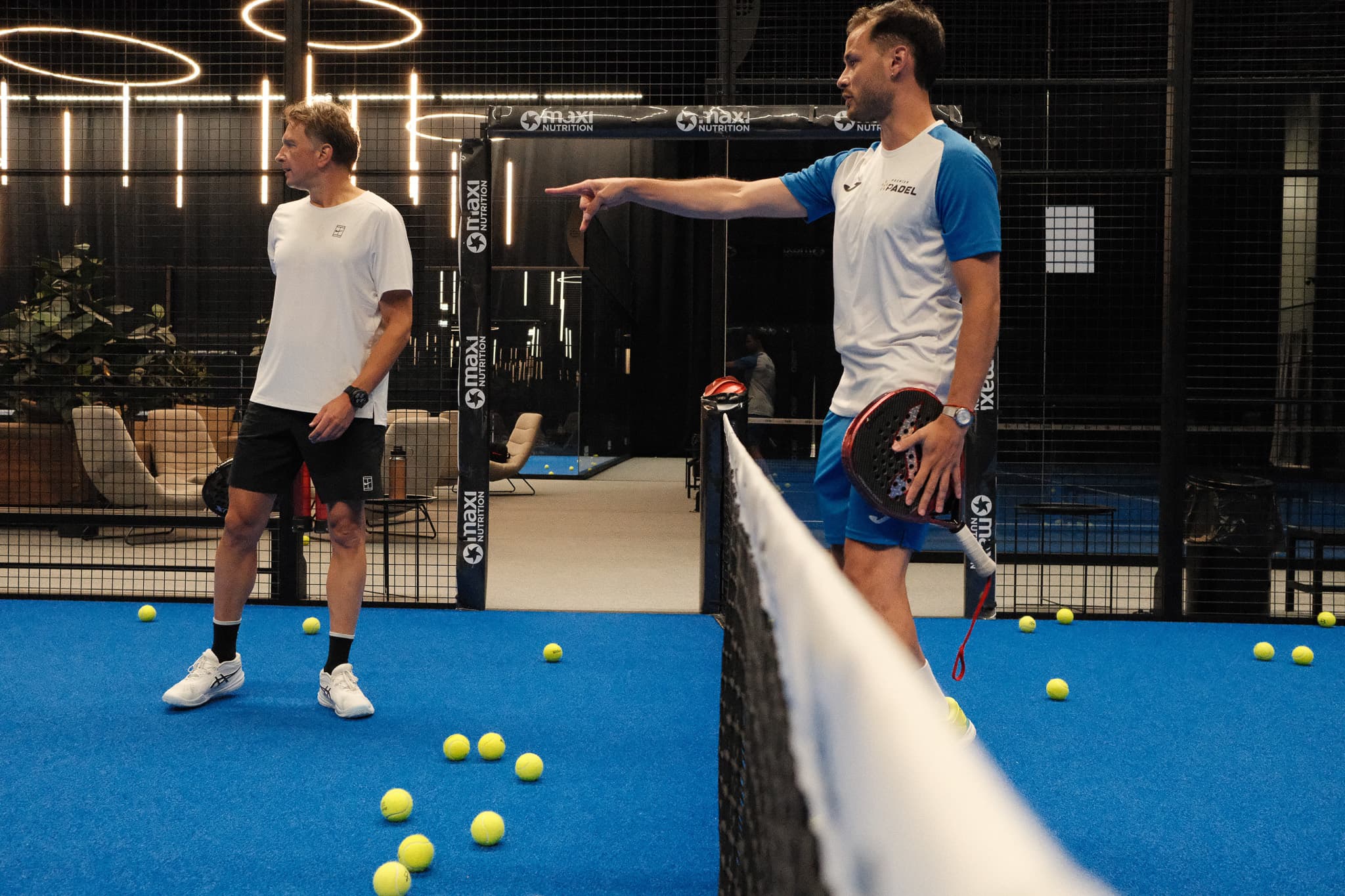 Axel coaching on a padel court